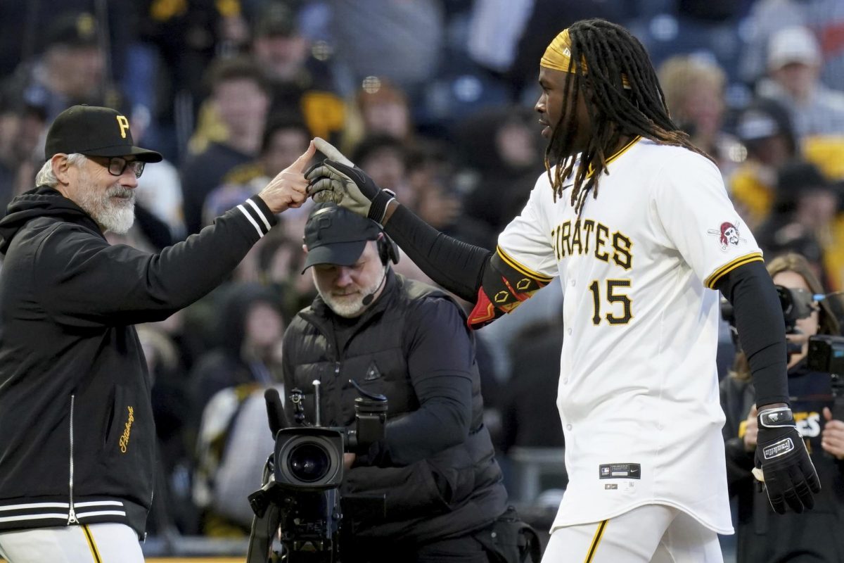 Pittsburgh Pirates Oneil Cruz, right, celebrates with manager Derek Shelton, left, after hitting a walk-off single during the 11th inning of a baseball game against the Baltimore Orioles, Saturday, April 6, 2024, in Pittsburgh.