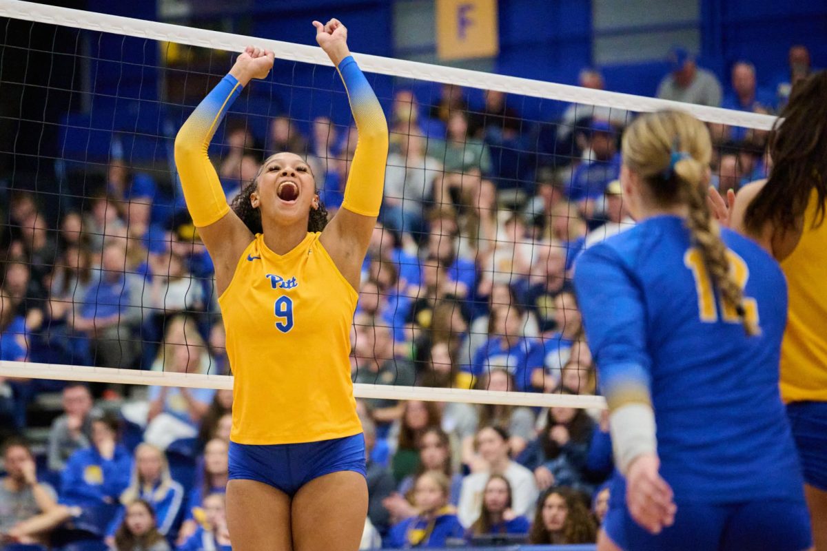 First-year middle blocker Ryla Jones (9) celebrates during the women’s volleyball game against Penn State on Sunday afternoon in the Fitzgerald Field House.