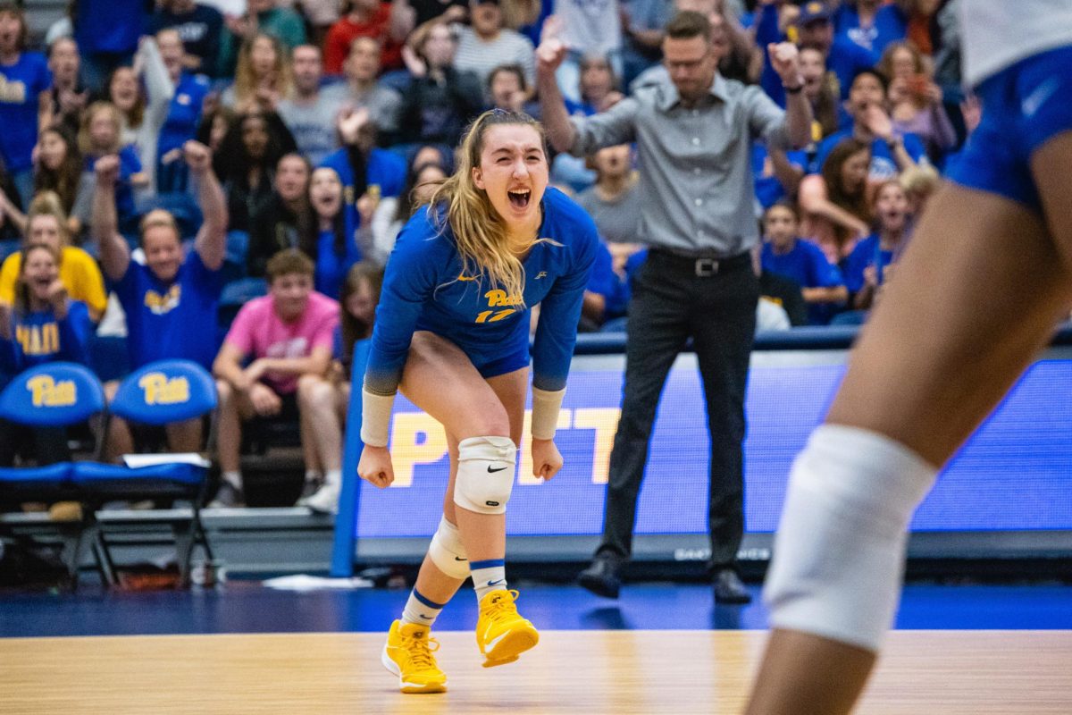 Junior Emmy Klika (12) screams in celebration after winning a point during a match against Georgia Tech at the Fitzgerald Field House on Oct. 7, 2023.