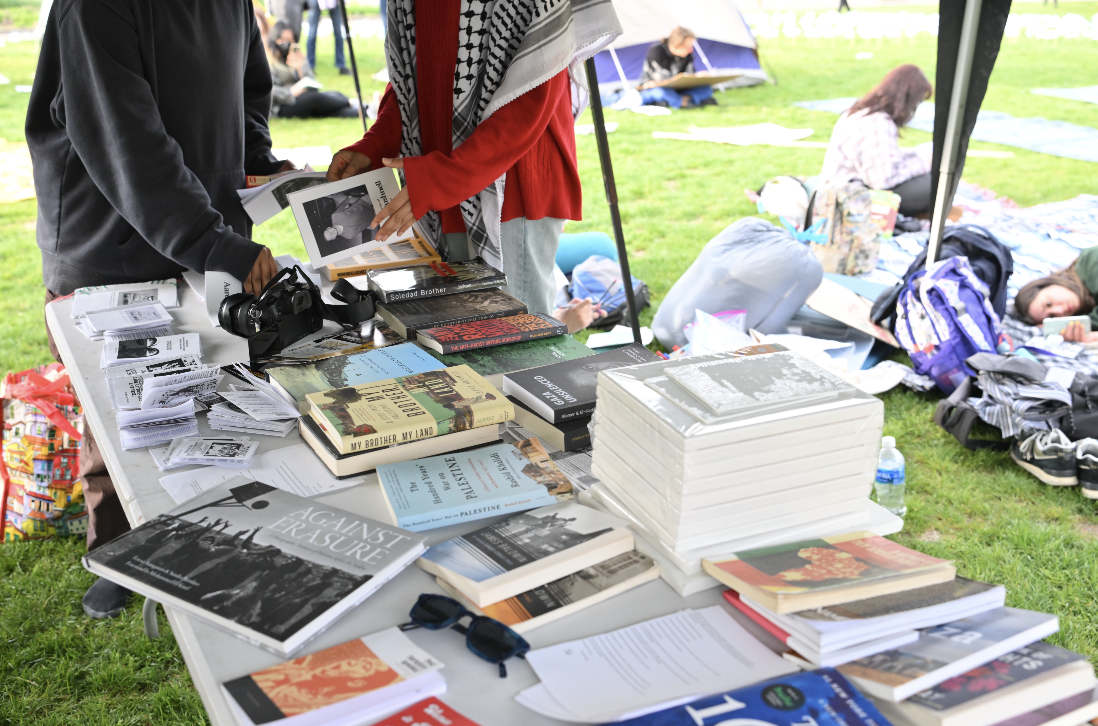 Pro-Palestine+literature+at+a+sit-in+protest+in+Schenley+Plaza+on+Tuesday.+