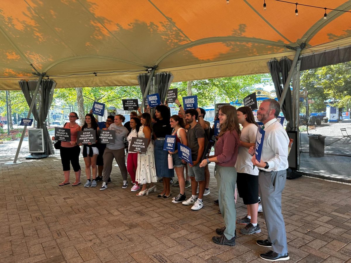 Attendees take a group picture after the Planned Parenthood event on Tuesday at Schenley Plaza.