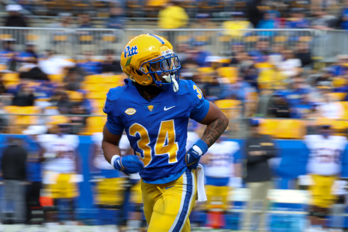 Redshirt junior running back Derrick Davis Jr. (34) runs on the field during Pitt football’s Blue-Gold Game on Saturday, April 13 at Acrisure Stadium.
