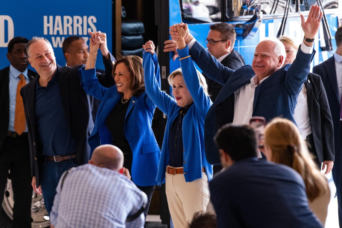 Vice President Kamala Harris, Husband Doug Emhoff, Minnesota Governor Tim Walz and Wife Gwen Walz greet supporters at Pittsburgh International Airport on Sunday.