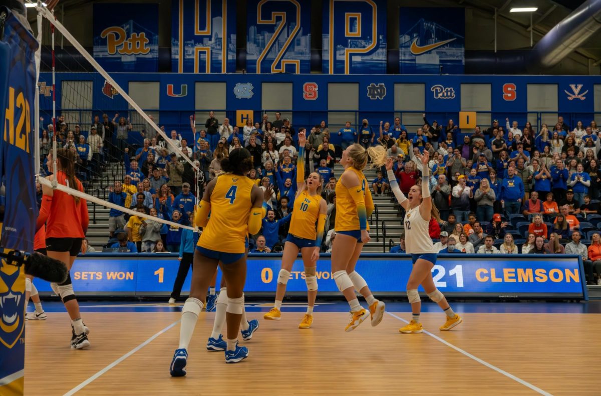 Opposite Hitter Rachel Fairbanks (10) celebrates at a match against Clemson.
