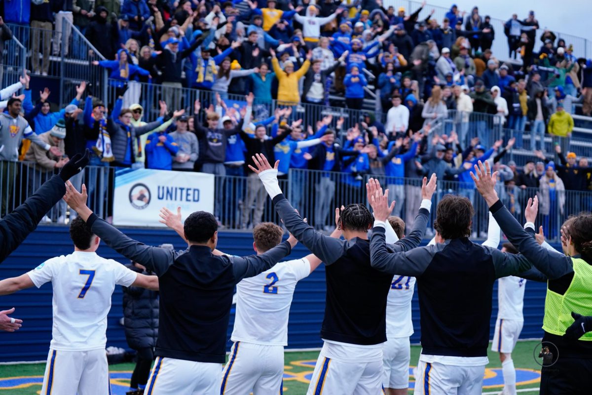 The Pitt men’s soccer team interacts with the student section.