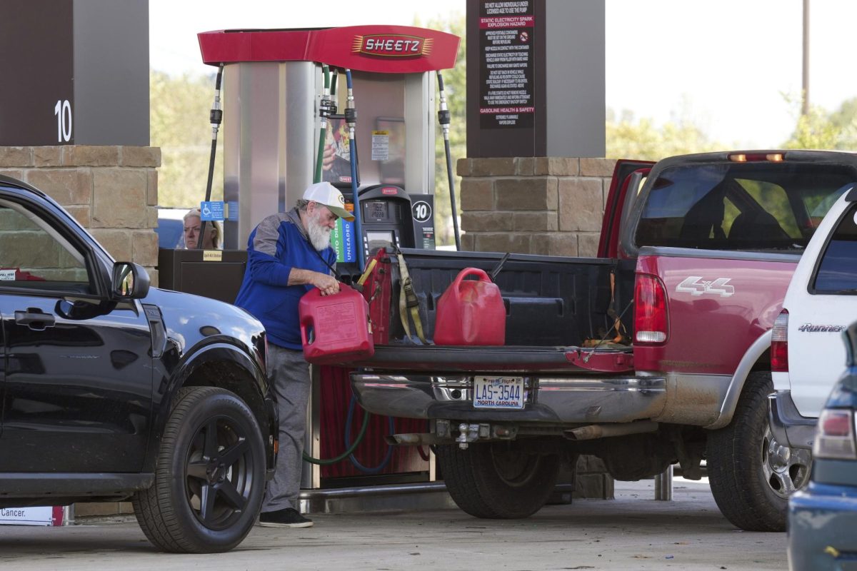 After waiting on long lines to fill up their gas tanks at the Sheetz station, people were also filling up containers of gas for their generators after Hurricane Helene caused power outages on Saturday, Sept. 28, 2024, in Morganton, N.C.