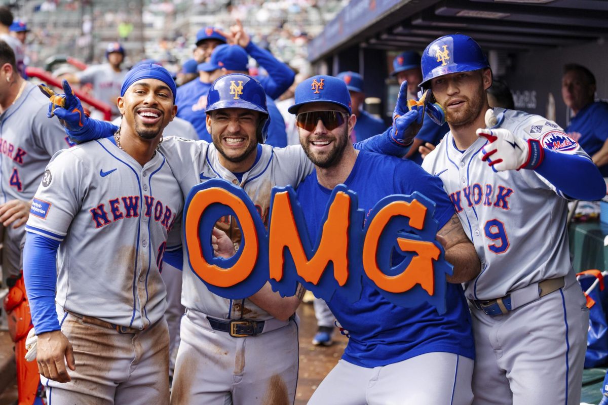 New York Mets' Francisco Lindor, left, José Iglesias, left center, David Peterson, right center, and Brandon Nimmo, right, celebrate in the dugout after taking the lead in the eighth inning of a baseball game against the Atlanta Braves, Monday, Sept. 30, 2024, in Atlanta.