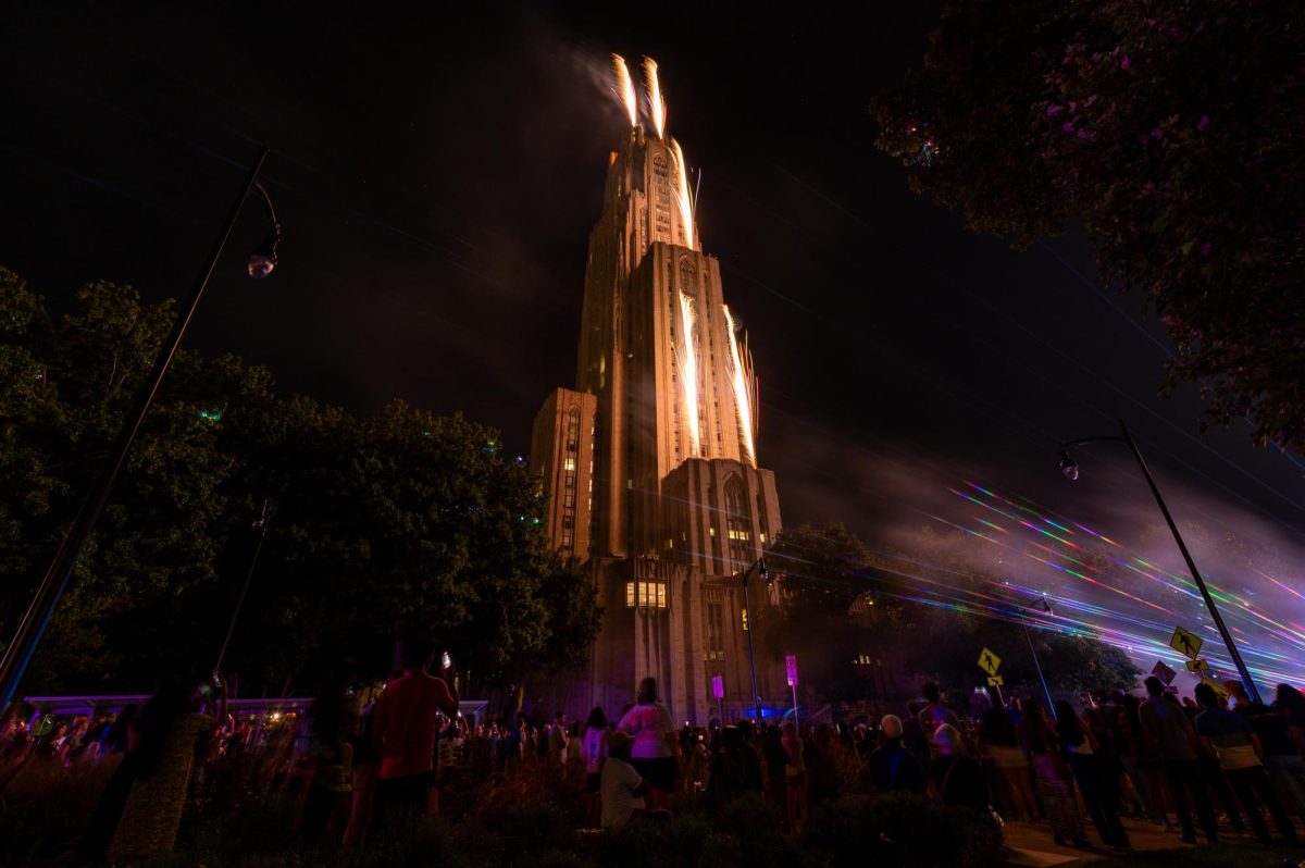 Fireworks and lasers illuminate the Cathedral of Learning on Friday night.