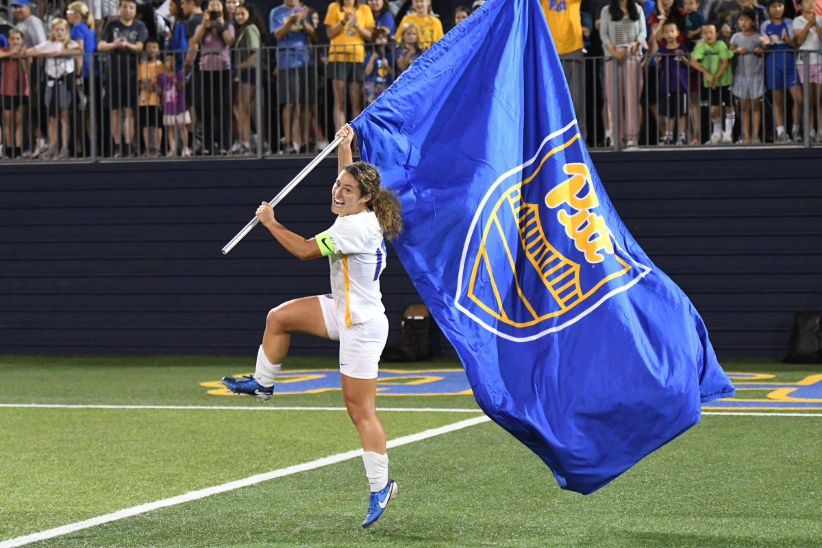 Fifth-year midfielder Chloe Minas (15) celebrates after Pitt women’s Soccer’s game against Louisville on Saturday at Ambrose Urbanic Field.