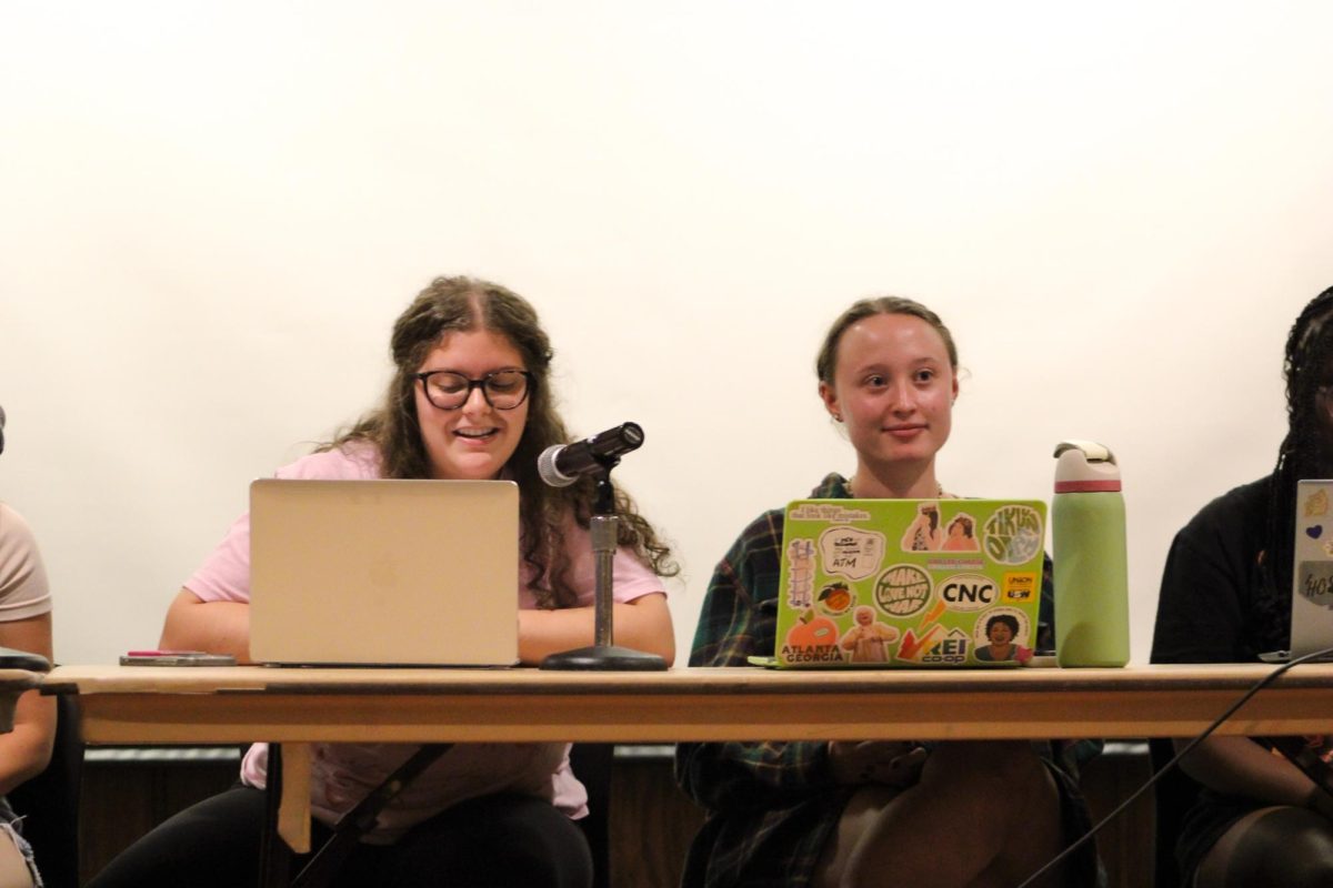 SGB President Sarah Mayer and another SGB board member listen and take notes during a meeting Tuesday Sept. 9 at Nordy’s Place.