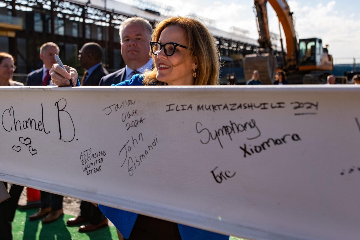 Pitt Chancellor Joan Gabel signs the final beam at the BioForge “topping off” ceremony on Friday, Sept. 6.