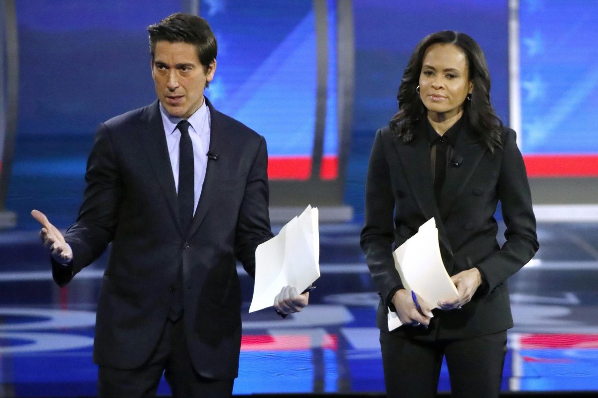 ABC World News Tonight Anchor David Muir, left, addresses members of the audience while standing with ABC News Live Anchor Linsey Davis.