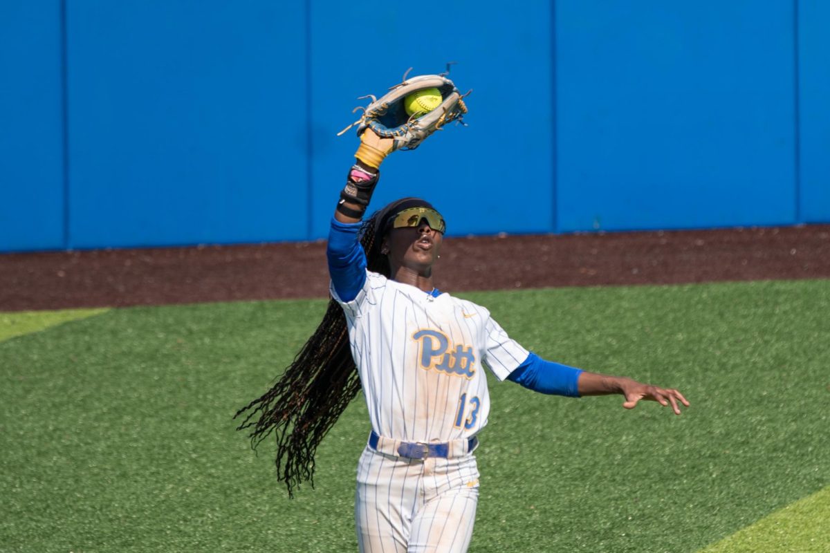 Sophomore outfielder Ahmari Braden (13) catches a flyball during Pitt softball’s game against Kent State on Sunday at Vartabedian Field.