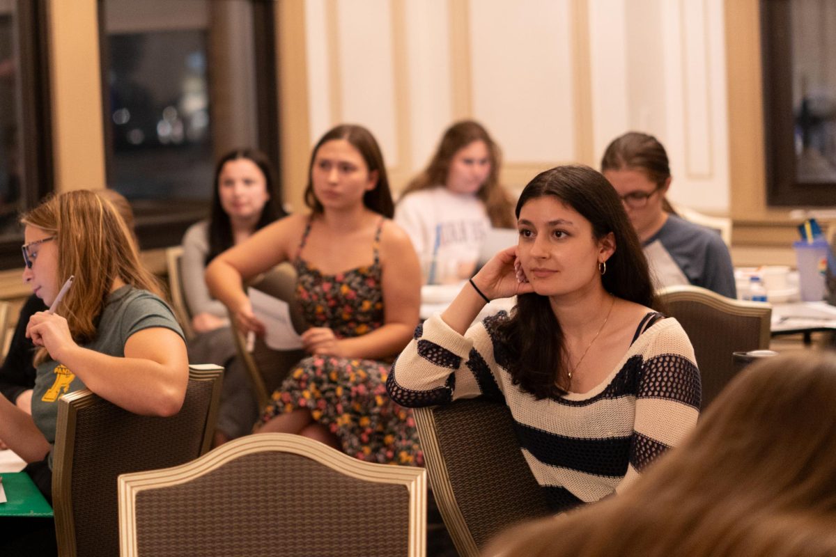 Students watch the debate between Vice President Kamala Harris and former President Donald Trump during the Pitt Votes debate watch party on Tuesday.