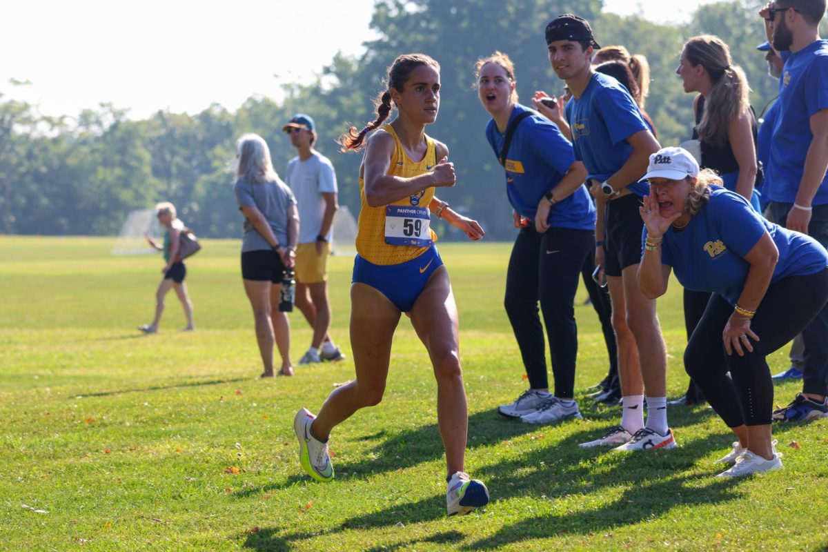 A Pitt runner takes part in the Panther Open in Schenley Park on Friday.