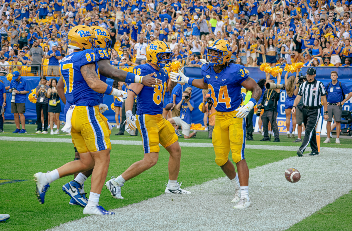 Pitt football players celebrate a touchdown at the game against Kent State on Saturday, Aug. 31.