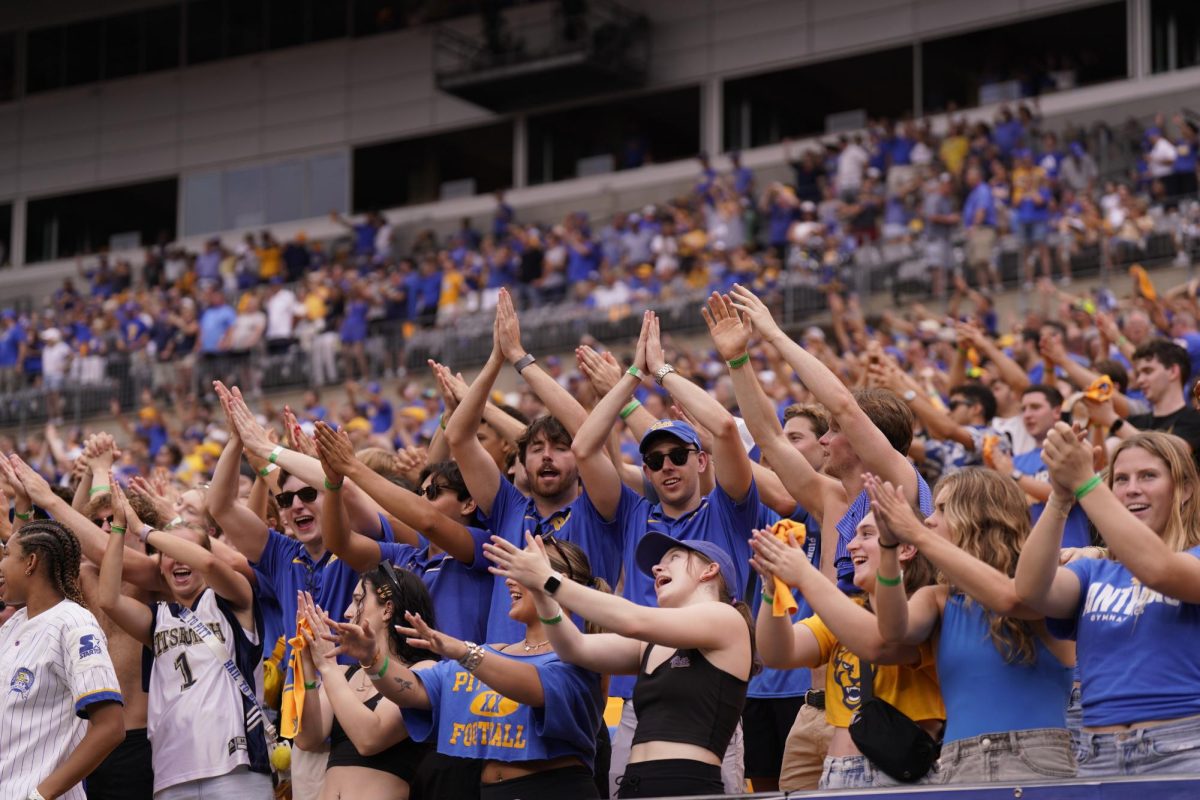 Students in the Panther Pitt sing “Sweet Caroline” between the third and fourth quarter of Pitt football’s game against Kent State on Saturday Aug. 31 at Acrisure Stadium.