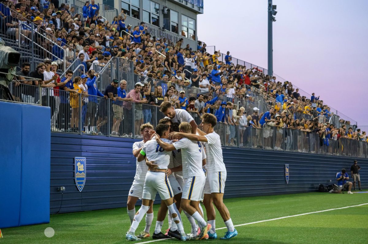 Pitt men’s soccer celebrates after a goal during a game at Ambrose Urbanic Field.
