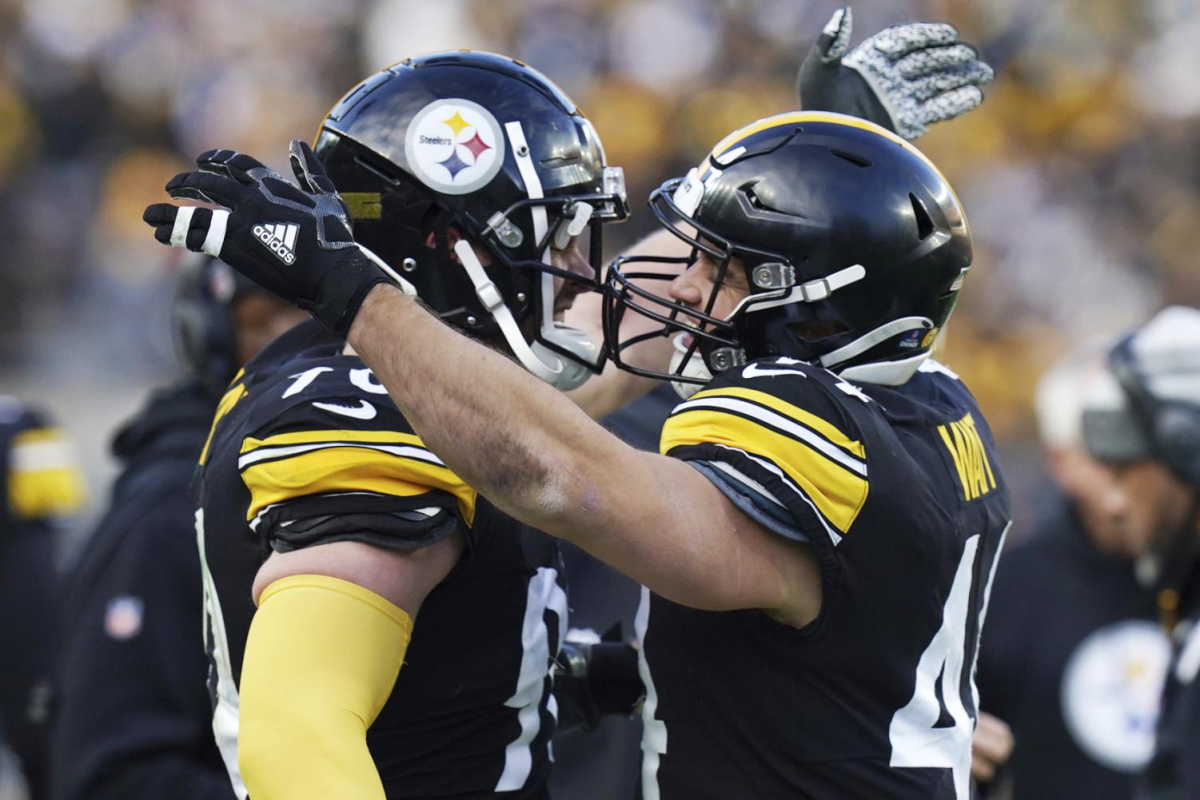 Pittsburgh Steelers fullback Derek Watt, right, celebrates with his brother T.J. Watt after scoring during the second half of an NFL football game against the Cleveland Browns in Pittsburgh, Sunday, Jan. 8, 2023.
