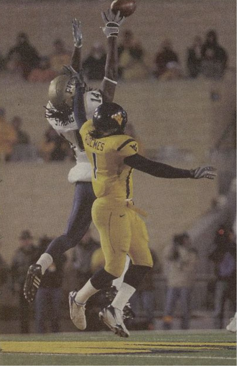 Darrell Strong grabs a pass from Pat Bostick in front of WVU cornerback John Holmes on a critical third-and-long play during the fourth quarter of the 2007 Backyard Brawl on December 1, 2007.
