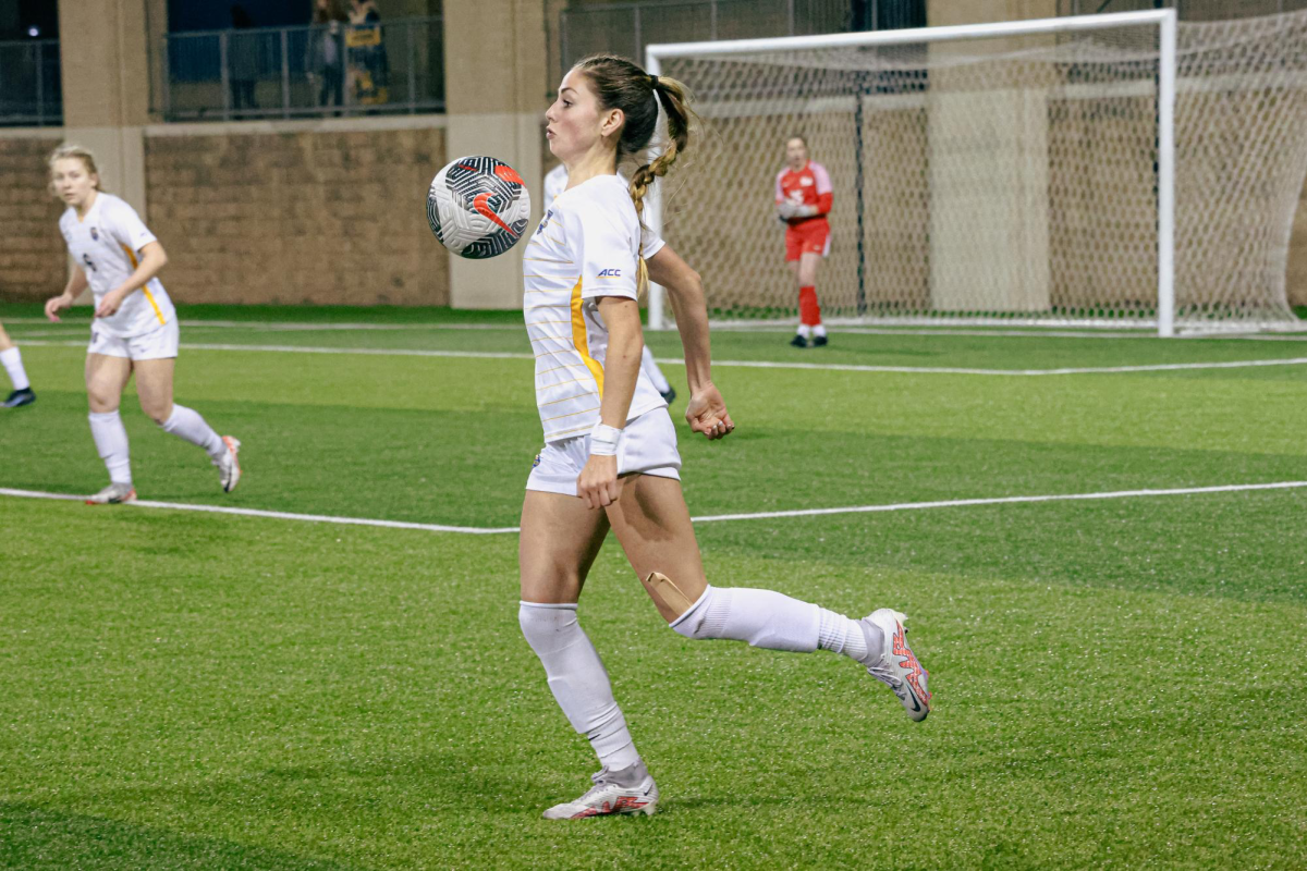 Senior forward Sarah Schupansky (5) chests the ball during the women’s soccer game against West Virginia at Ambrose Urbanic Field.
