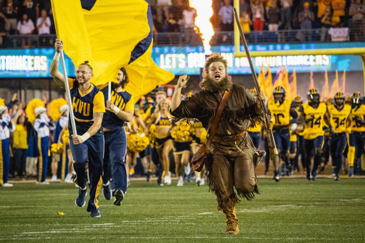 The West Virginia Mountaineer mascot charges onto the field ahead of the players before the Backyard Brawl in Morgantown, West Virginia, on Saturday, Sept. 16, 2023.
