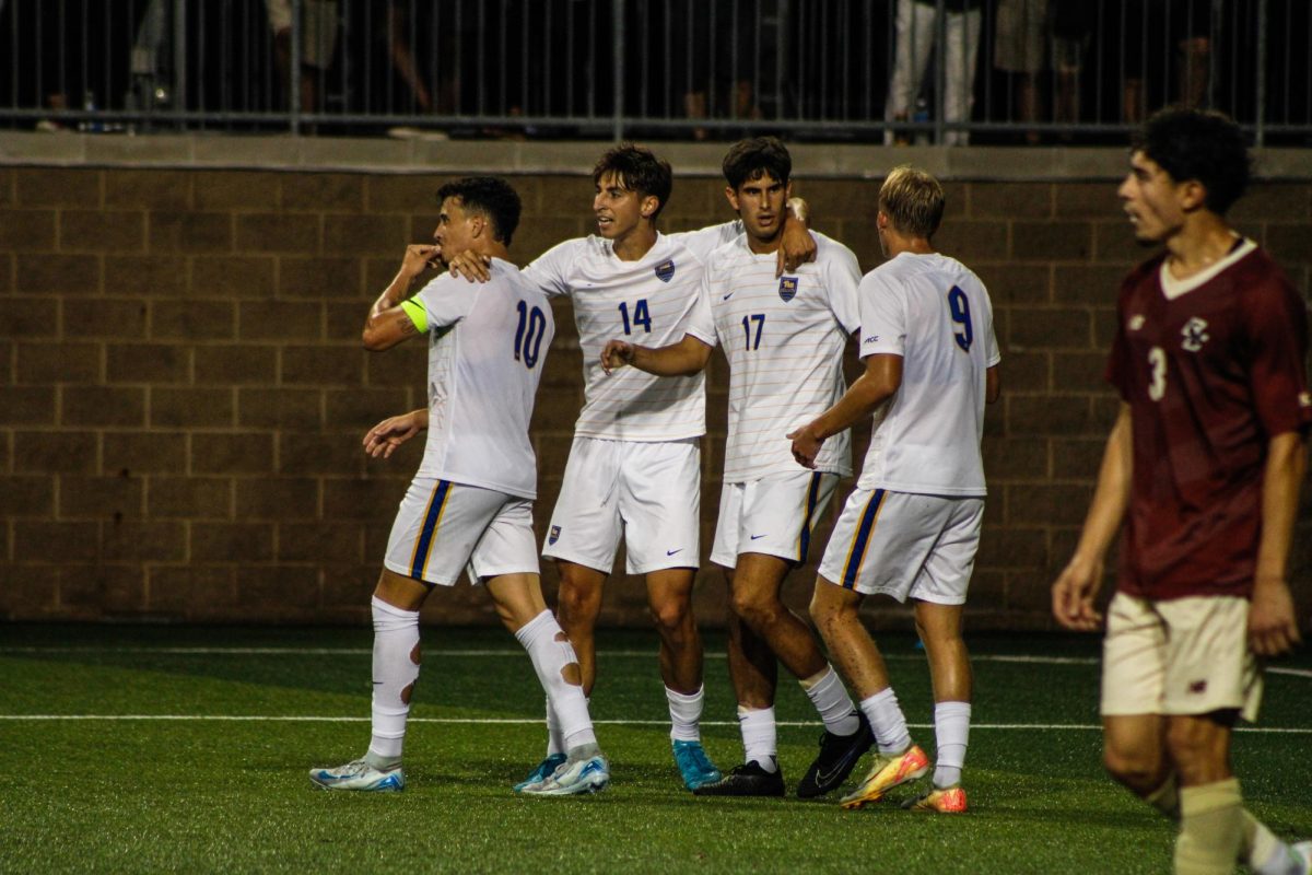 Pitt men’s soccer strategize at the match against Boston College at Ambrose Urbanic Field on Friday. 
