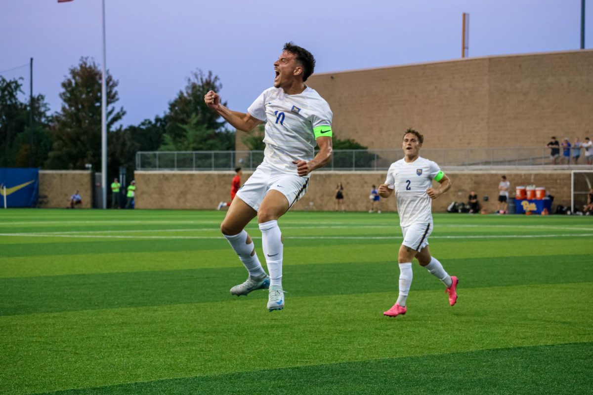 Senior midfielder Guilherme Feitosa (10) celebrates after scoring a goal during Pitt men’s soccer’s game against Louisville at Ambrose Urbanic Field on Friday.