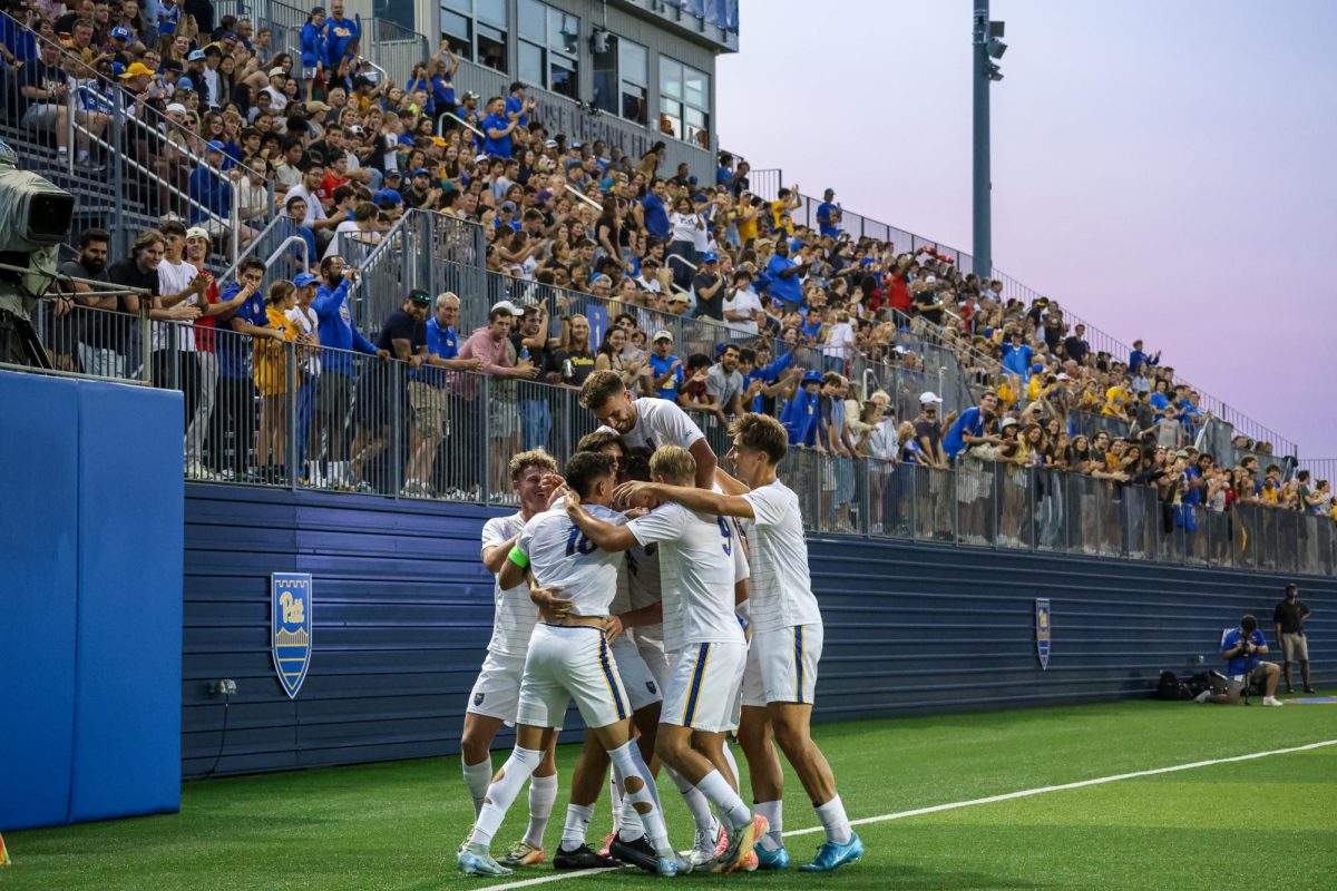 The Pitt men’s soccer team celebrates after a goal during Pitt men’s soccer’s game against Louisville at Ambrose Urbanic Field on Friday, Sept. 12.