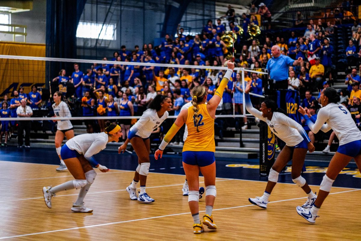 Pitt volleyball celebrates a play at the match against Marquette in the Fitzgerald Field House on Sunday, Sept. 22.