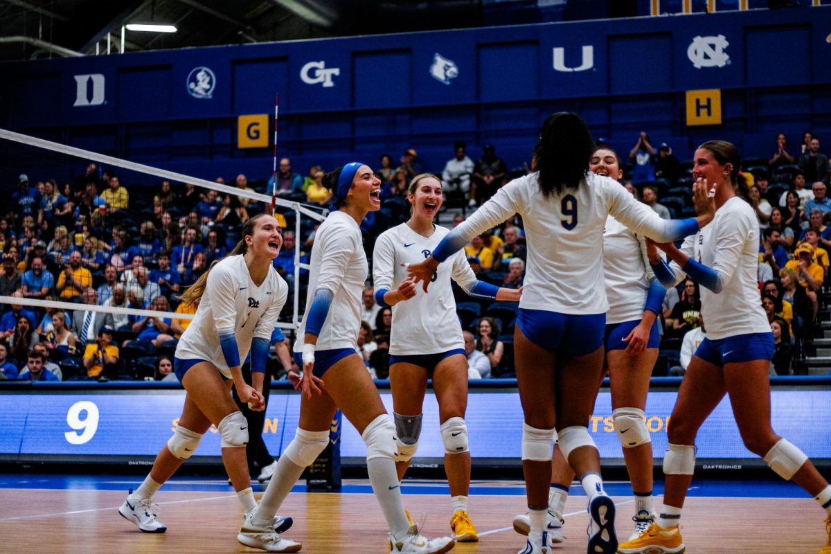 Pitt volleyball celebrates after a play at the game against UMBC in the Fitzgerald Field House on Wednesday.