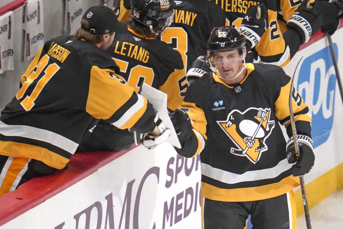 Pittsburgh Penguins' Noel Acciari (55) returns to the bench after scoring during the first period of a preseason NHL hockey game against the Columbus Blue Jackets in Pittsburgh, Friday, Oct. 4.