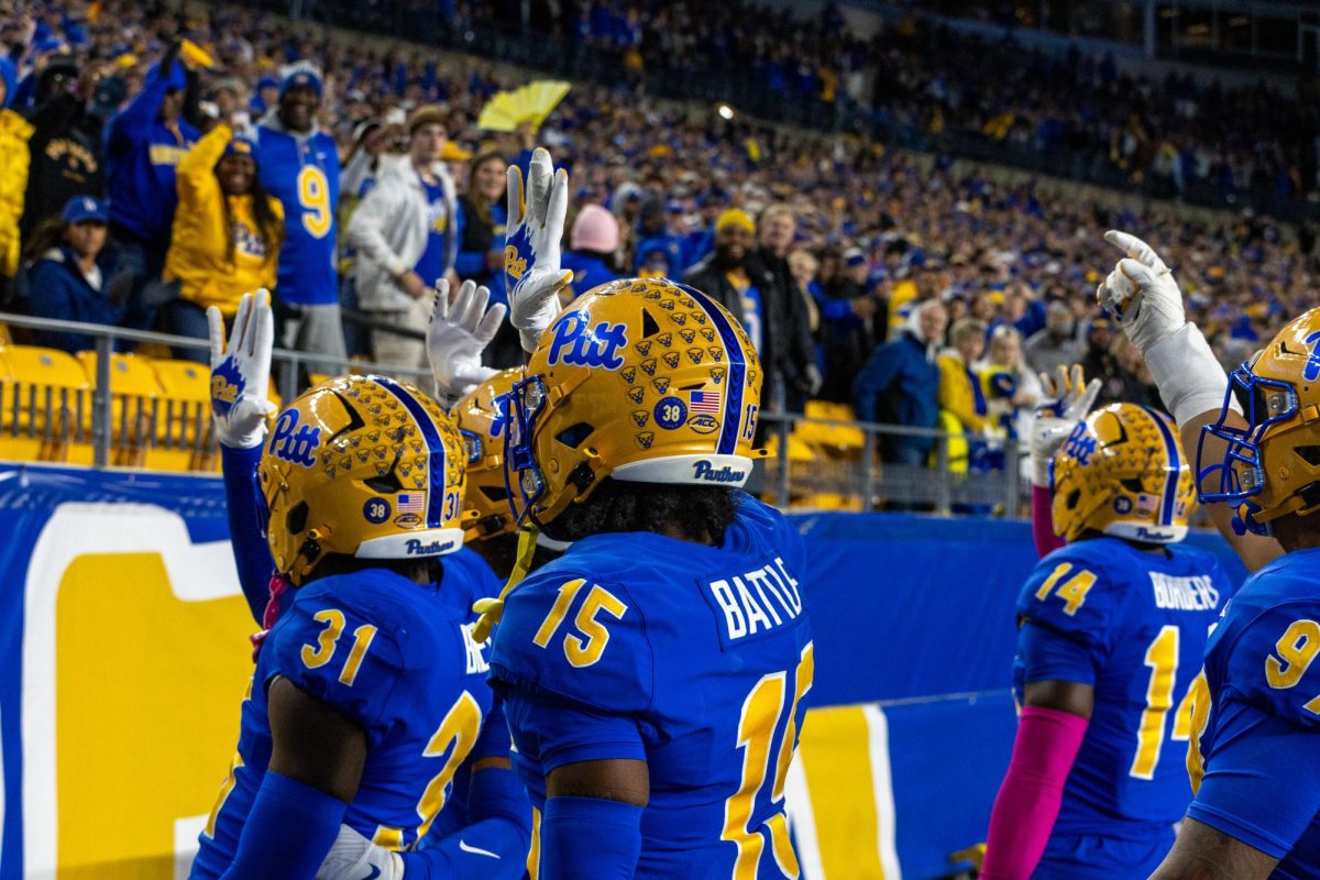 The Pitt Football team does the shark celebration at the football game against Syracuse in Acrisure Stadium on Thursday, Oct. 24.