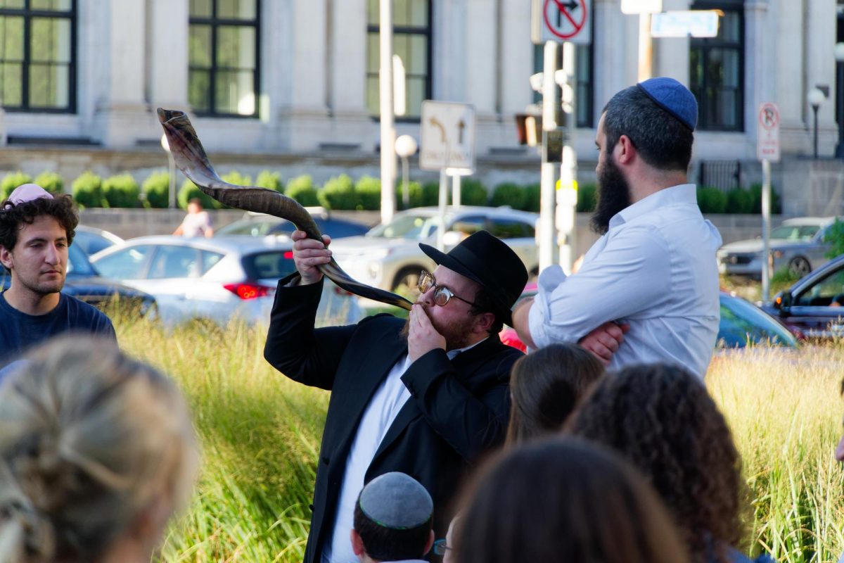 A ba'al tekiah blows the Shofar at the William Pitt Union on Thursday.