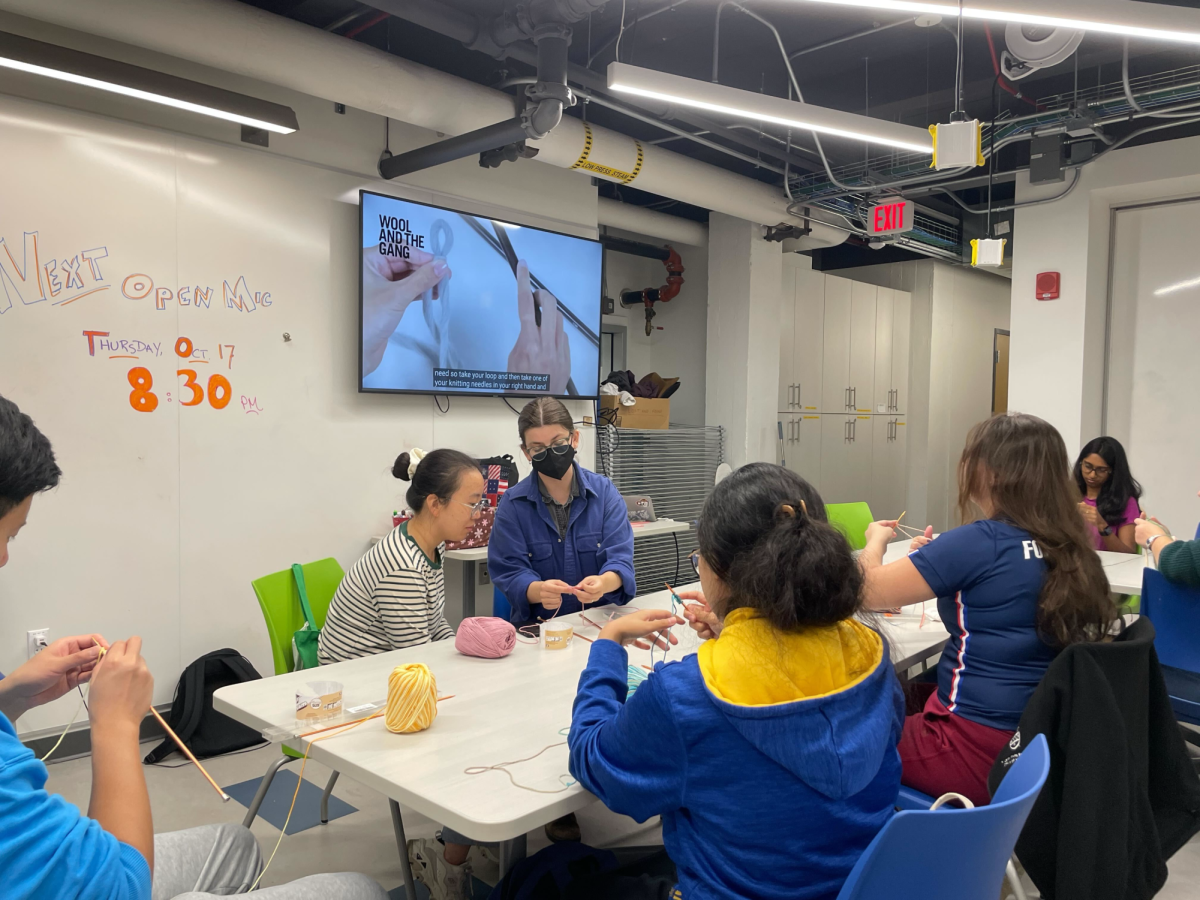 Chloe Baierl guides participants through basic knitting techniques at a knitting event hosted by the Center for Creativity on Tuesday, Oct. 1. 