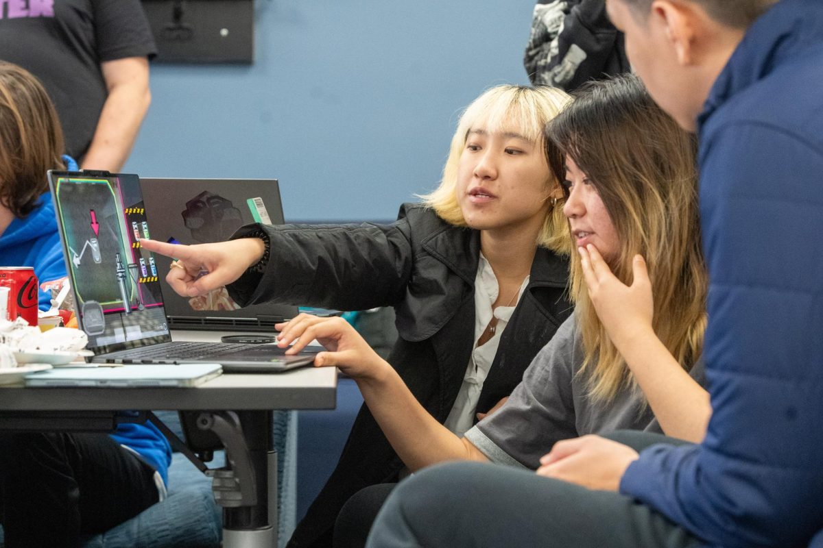 A team works on their game at the Games 4 Social Impact Jam on Friday, Oct. 18. 