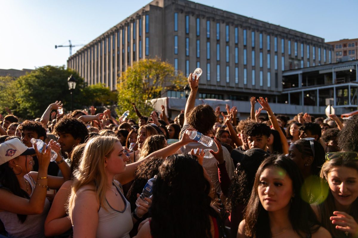 Water bottles are distributed among Fall Fest-goers at the 2024 Pitt Program Council Fall Fest on Sunday.