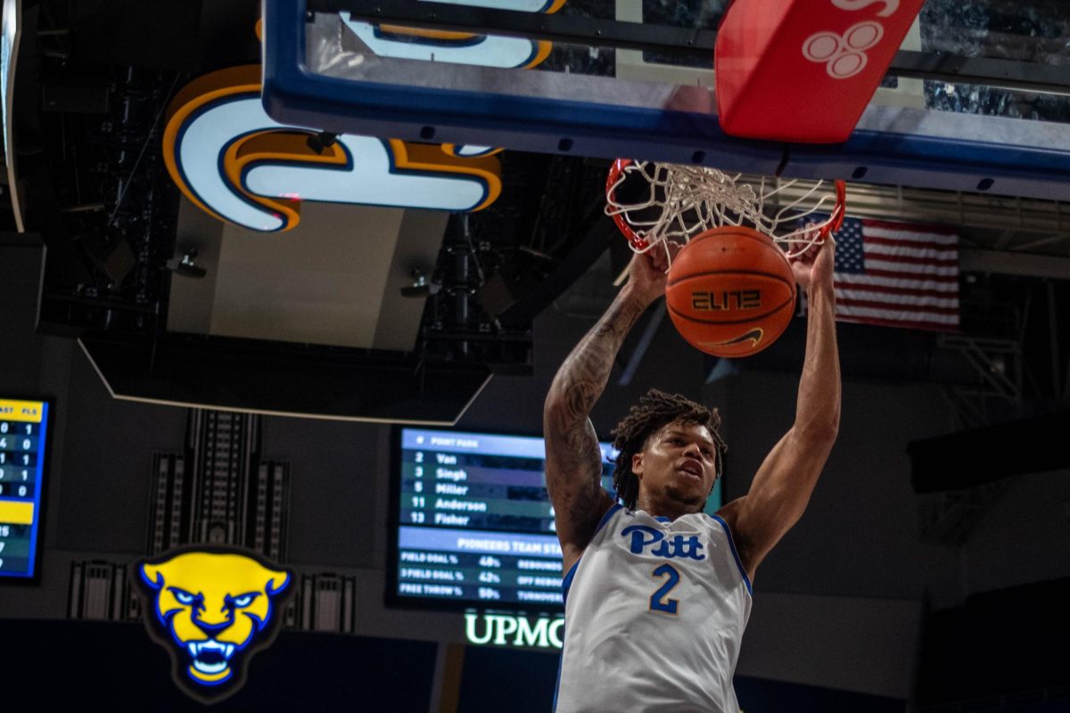 Junior forward Cameron Corhen (2) dunks during Pitt men’s basketball’s scrimmage at the Petersen Events Center on Tuesday, Oct. 22.