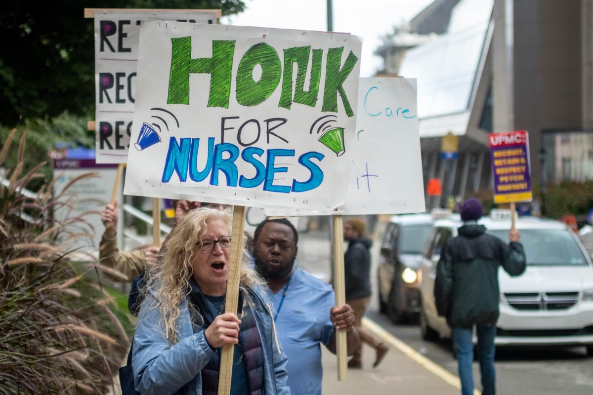 Nurses hold signs and chant during the UPMC Rally for Mental Healthcare on Wednesday.