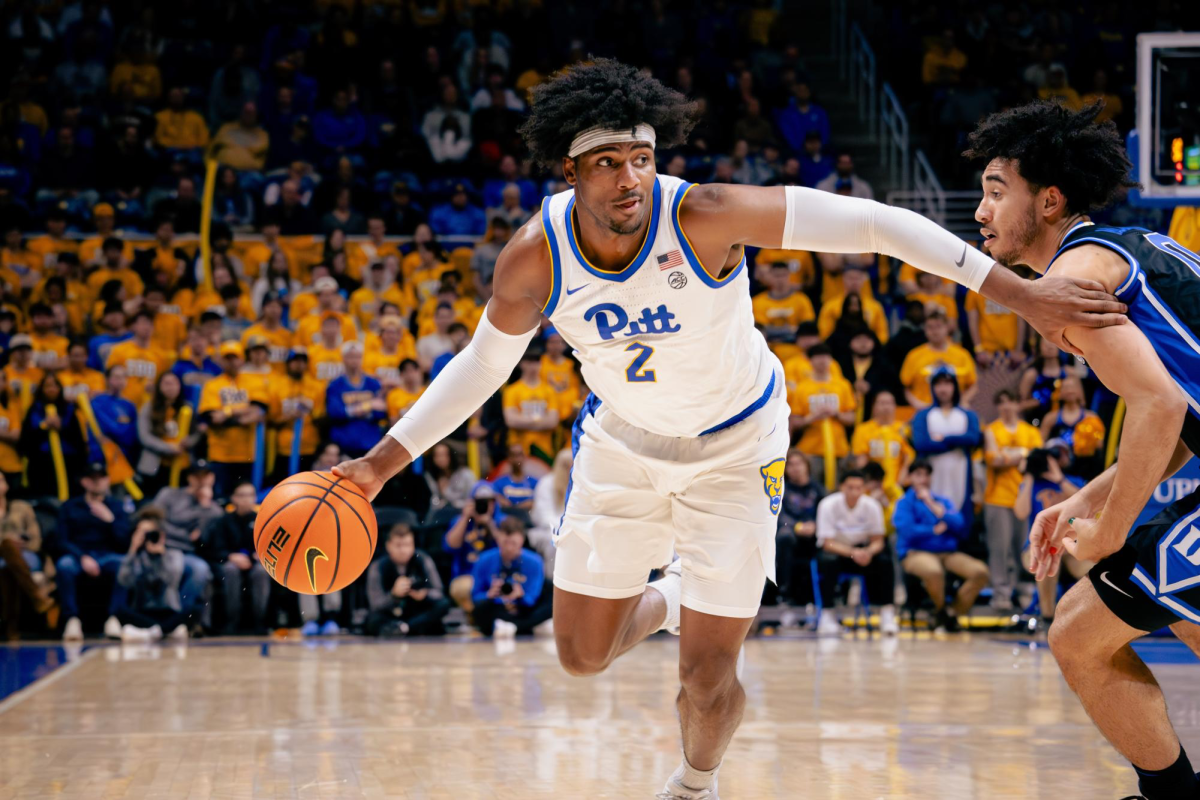 Senior forward Blake Hinson (2) drives to the basket during Pitt men’s basketball’s game against Duke on Tuesday, Jan. 9.