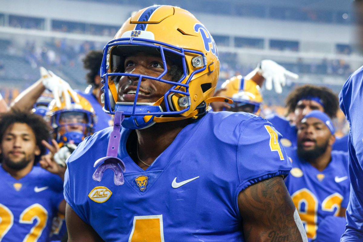 Daniel Carter walks toward the Pitt band after the Backyard Brawl on Saturday, Sept. 14.