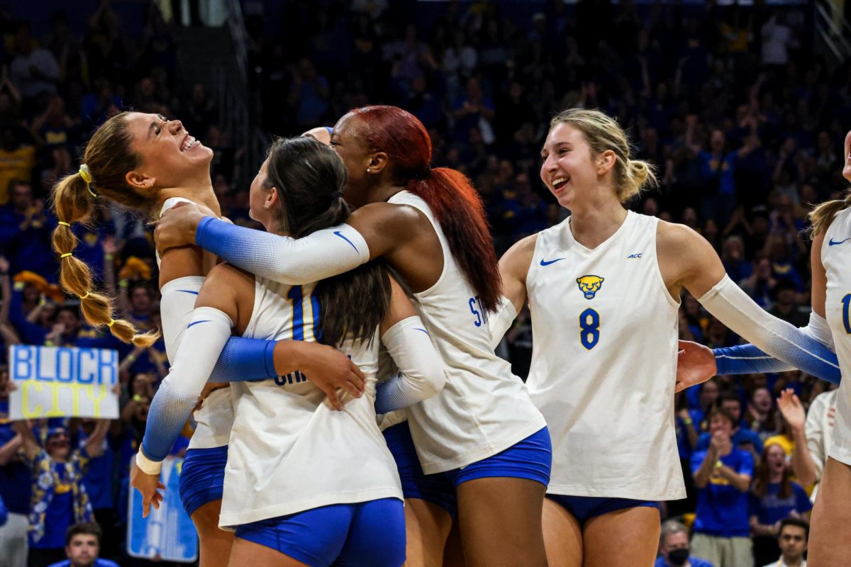 Pitt volleyball celebrates after winning a set at the game against Louisville in the Petersen Events Center on Friday, Oct. 25.