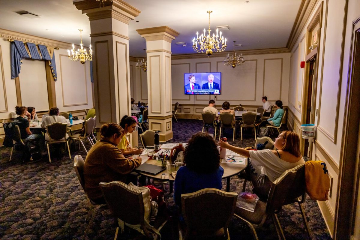 Students watch the vice presidential debate on Tuesday, Oct. 2.
