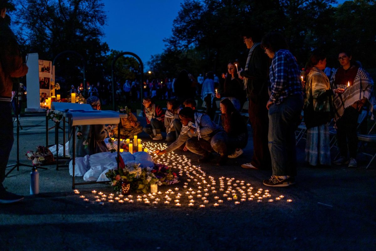 Attendees light candles during the Community Vigil for Gaza on Monday, Oct. 7.
