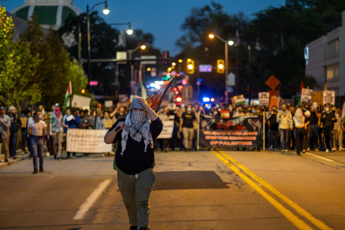 A protester leads the march on Thursday, Oct. 3
