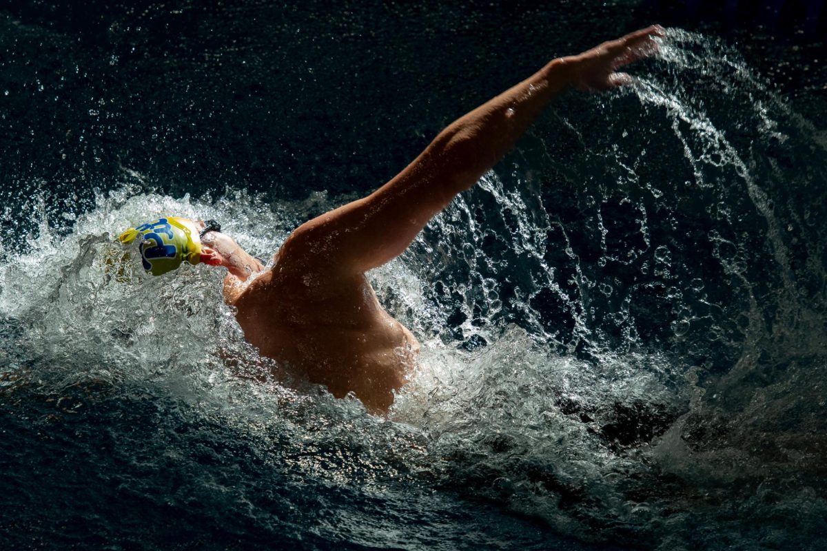 A member of Pitt's swimming and diving team mid-stroke during a meet against Army in Trees Hall on Sept. 22, 2023.