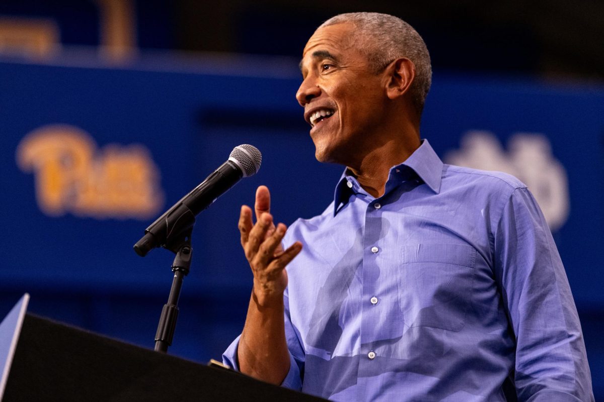 Former President Barack Obama speaks at the Harris-Walz campaign event in the Fitzgerald Field House on Thursday.