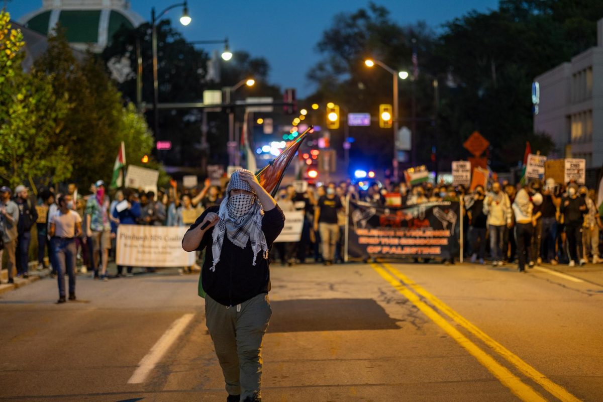 A protester leads the march on Thursday, Oct. 3.