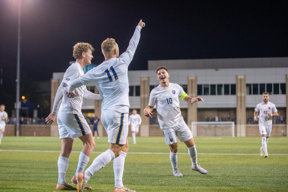 Pitt men's soccer celebrates together after scoring against Virginia on Friday Oct. 25th