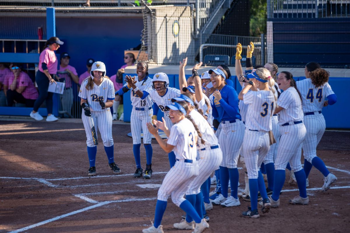 Pitt softball cheers at the softball game against RMU in Vartabedian Field on Saturday.